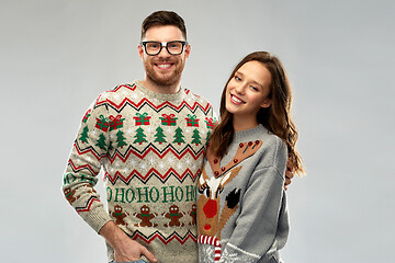 Image showing happy couple at christmas ugly sweater party