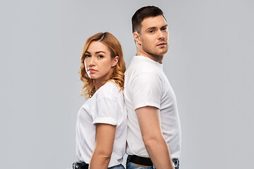 Image showing portrait of sad couple in white t-shirts