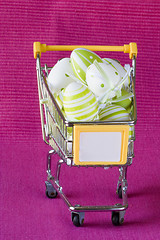 Image showing Shopping cart full of easter eggs