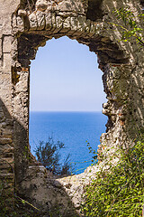 Image showing View through old abandoned dilapidated building on the blue seas