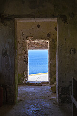 Image showing View through old abandoned dilapidated building on the blue seas