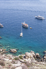 Image showing View of the Tremiti Islands. Boats near a rock stone coast. 