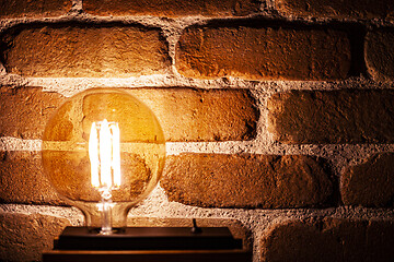 Image showing Illuminated grunge red brick wall background.