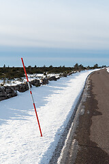 Image showing Red snow stake by roadside