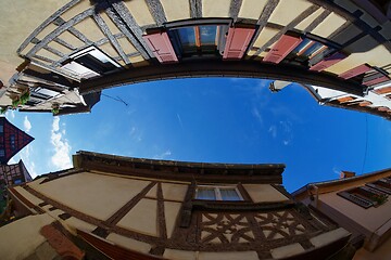 Image showing Fisheye view of the sky above a narrow street in Riquewihr town, Alsace, France