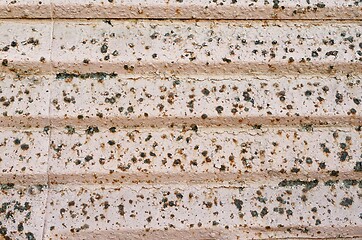 Image showing Old rusty iron curtain of a closed shop