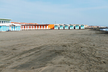 Image showing Beautiful sea and the black sandy beach with beach houses