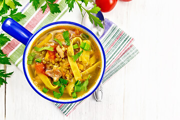 Image showing Soup with mung and noodles in blue bowl on board top