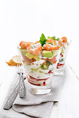 Image showing Salad with shrimp and avocado in two glasses on napkin