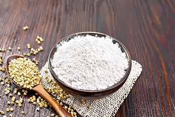 Image showing Flour buckwheat green in bowl on board