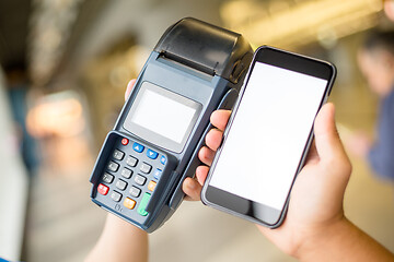 Image showing Customer pay with mobile phone