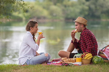 Image showing Couple in love enjoying picnic time