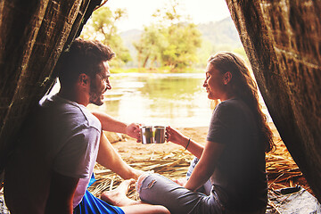 Image showing couple spending time together in straw tent