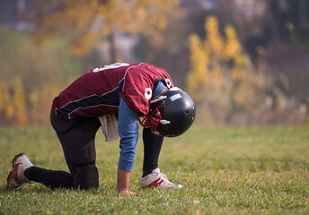 Image showing american football player resting after hard training