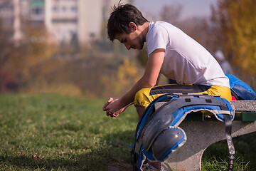 Image showing american football player resting after hard training