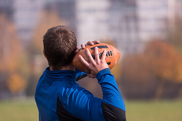 Image showing american football team with coach in action