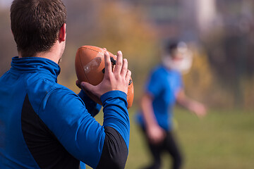 Image showing american football team with coach in action