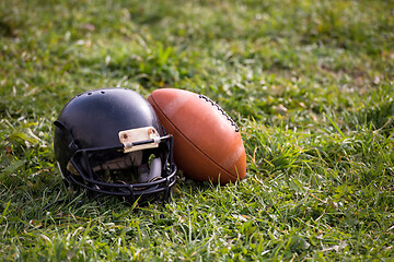 Image showing American football helmet and ball