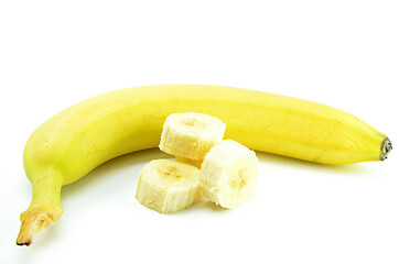 Image showing Ripe yellow banana with sliced bananas