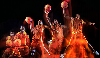 Image showing Young basketball player against dark background