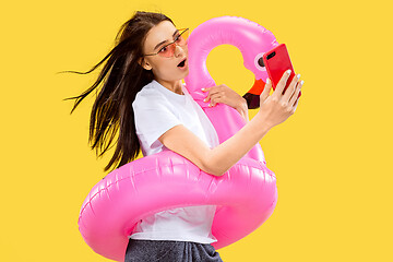 Image showing Portrait of beautiful woman isolated on yellow studio background