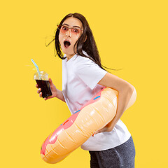 Image showing Portrait of beautiful woman isolated on yellow studio background