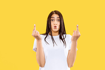 Image showing Portrait of beautiful woman isolated on yellow studio background