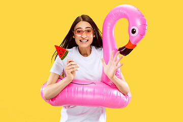 Image showing Portrait of beautiful woman isolated on yellow studio background