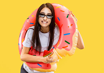 Image showing Portrait of beautiful woman isolated on yellow studio background