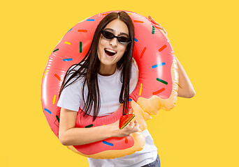 Image showing Portrait of beautiful woman isolated on yellow studio background