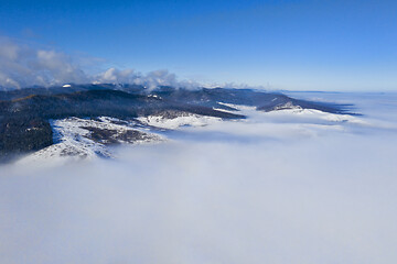 Image showing Morning mountain landscape with low clouds