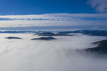 Image showing Low clouds in valley, aerial morning scene