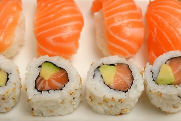 Image showing sushi with salmon and rolls on a plate