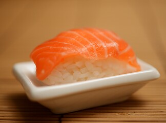 Image showing sushi with salmon on a small plate