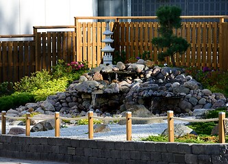 Image showing a traditional Japanese garden at the entrance to a supermarket c