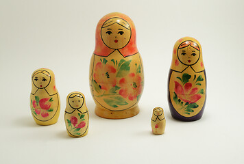 Image showing five traditional Russian nesting dolls on white 