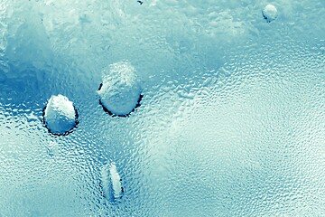 Image showing Drops of water on frosty surface closeup