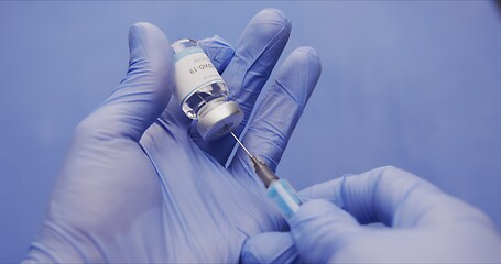 Image showing Vaccine in human hands closeup footage