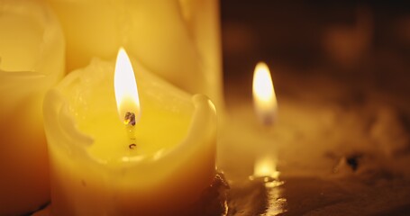 Image showing Candles glowing against dark background