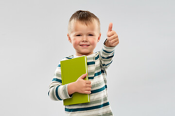 Image showing portrait of smiling boy holding book