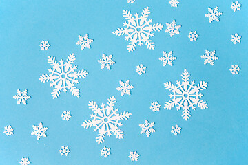 Image showing white snowflake decorations on blue background
