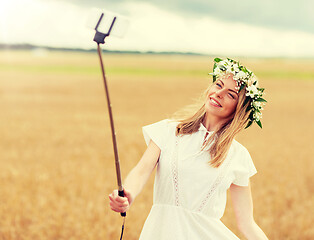 Image showing happy young woman taking selfie by smartphone