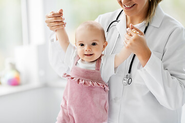 Image showing female pediatrician doctor with baby at clinic