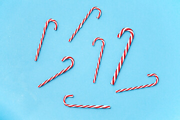 Image showing candy cane decorations on blue background