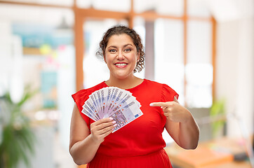 Image showing happy woman showing euro money banknotes