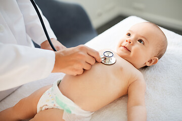 Image showing doctor with stethoscope listening to baby patient