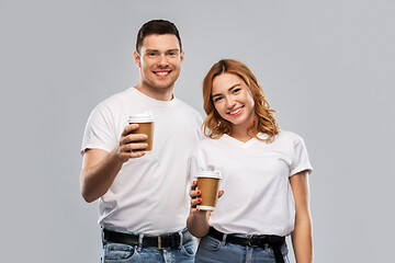 Image showing portrait of happy couple with takeaway coffee cups