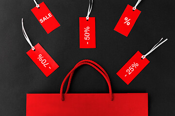 Image showing red shopping bag and tags with discount signs