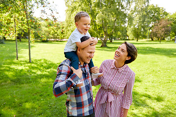 Image showing happy family having fun at summer park