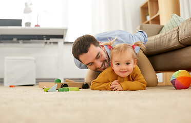 Image showing happy father with baby daughter playing at home